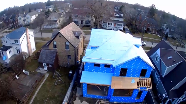 Henry Blueskin VP100 air and water barrier installed on a home