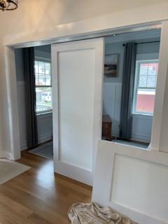 Sliding panel doors between rooms