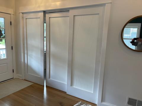 Entry with panel doors and built-ins