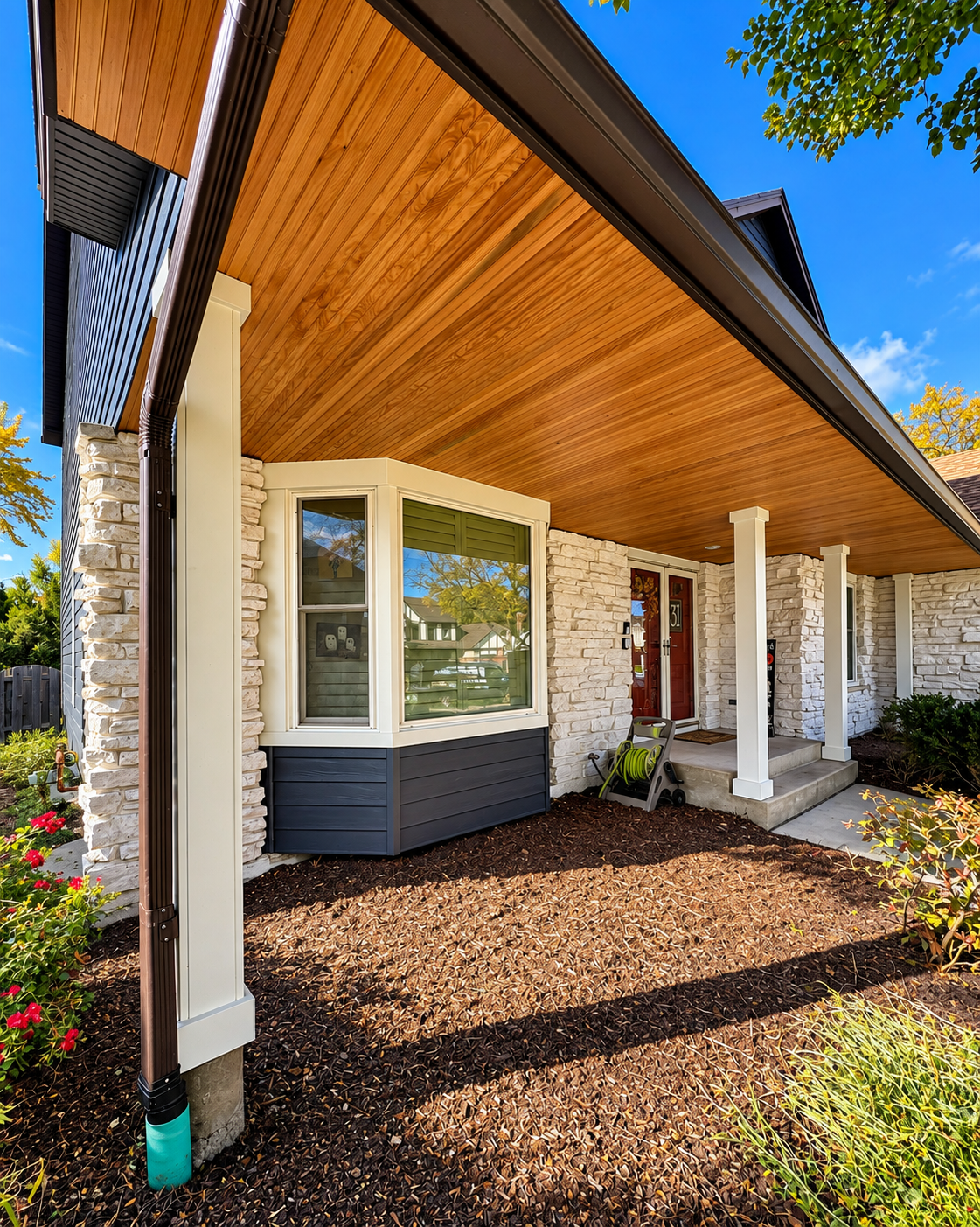 Covered front portico with wood ceiling