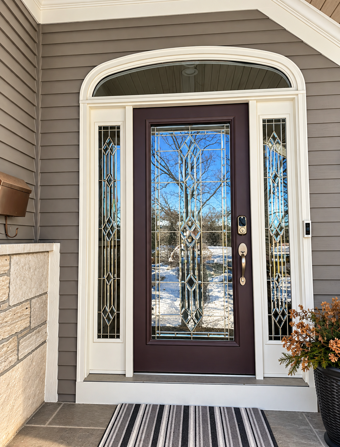 Entry door with leaded glass sidelights and arched transom
