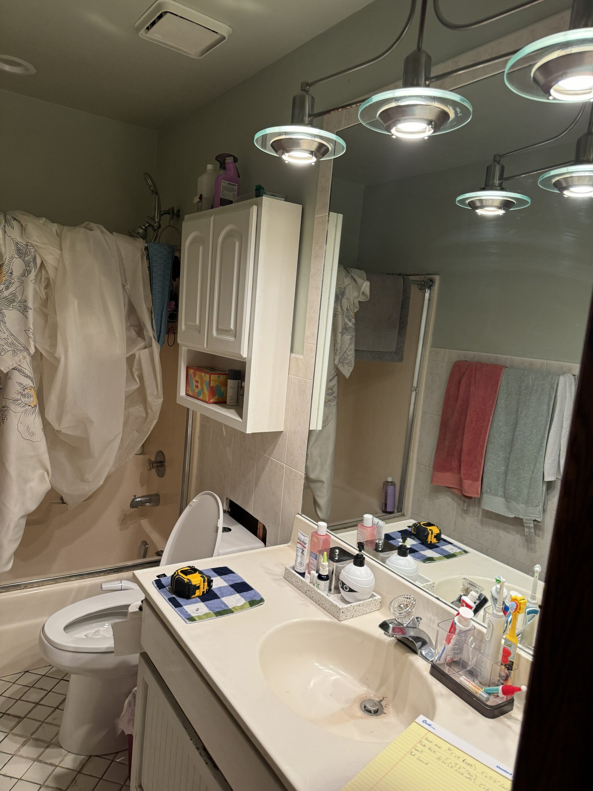 Bathroom makeover before and after: vanity replacement, tile & flooring