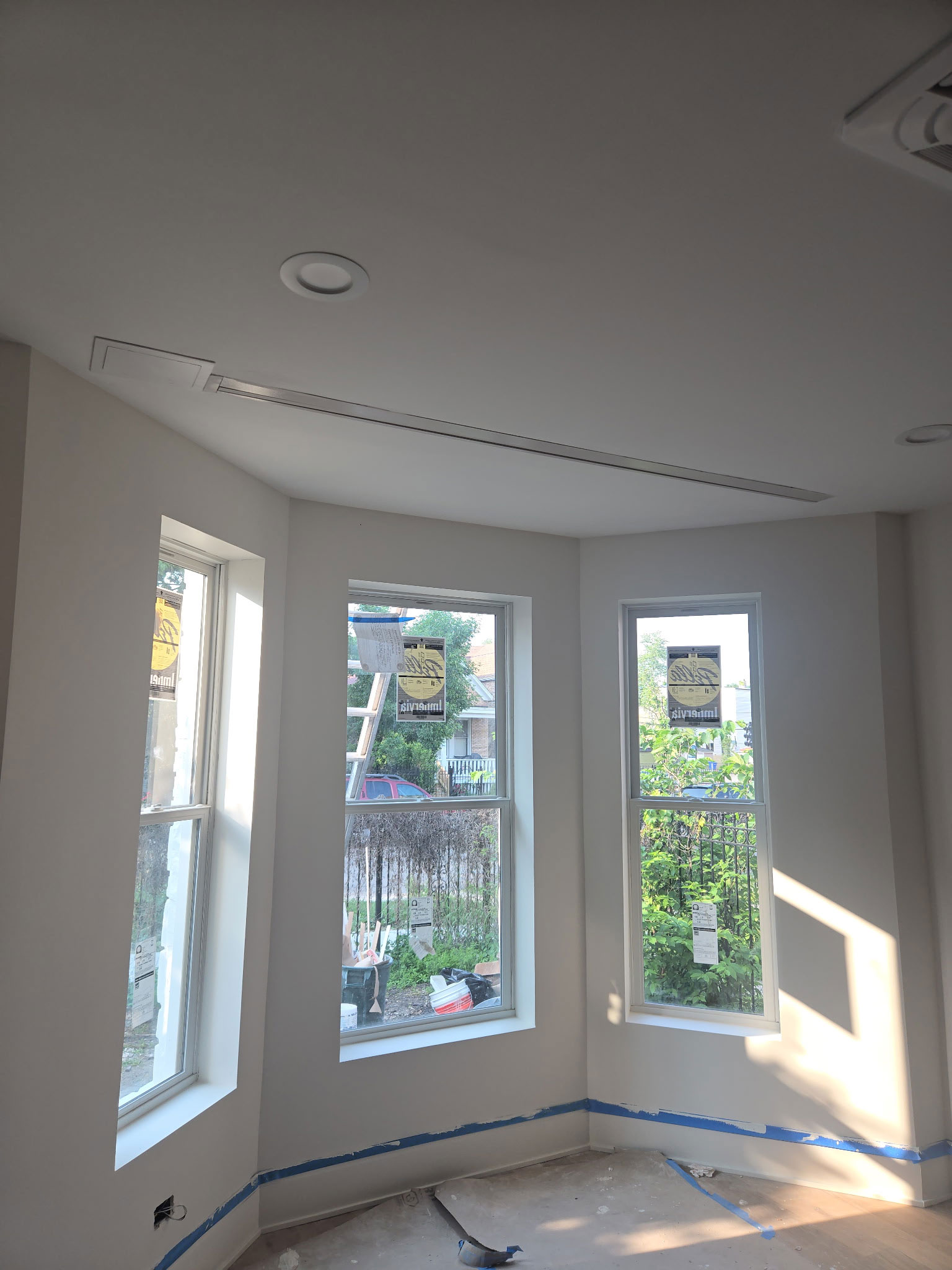 Pella Impervia fiberglass bay window installation