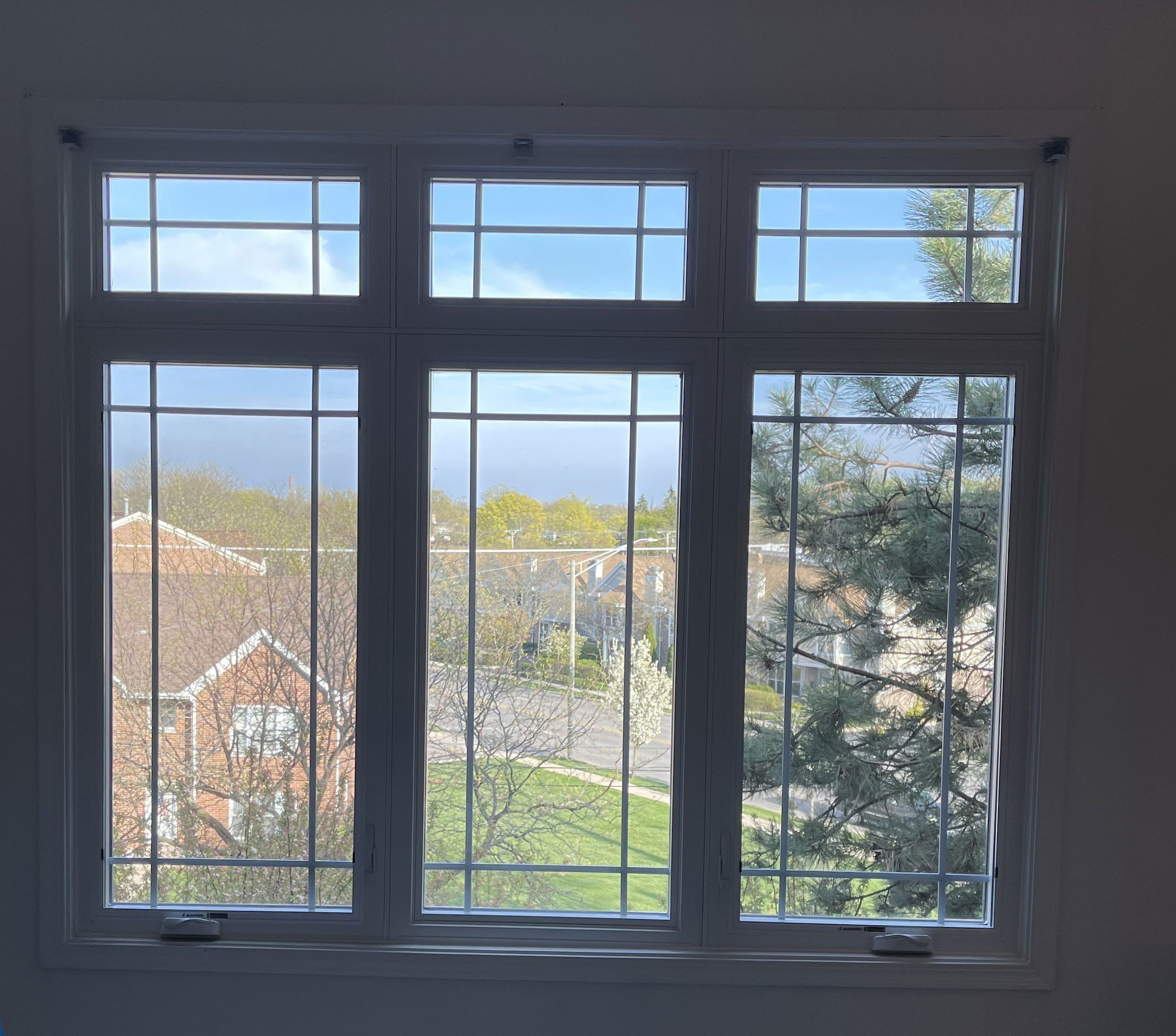 Pella Impervia fiberglass casement windows with transom, three-lite