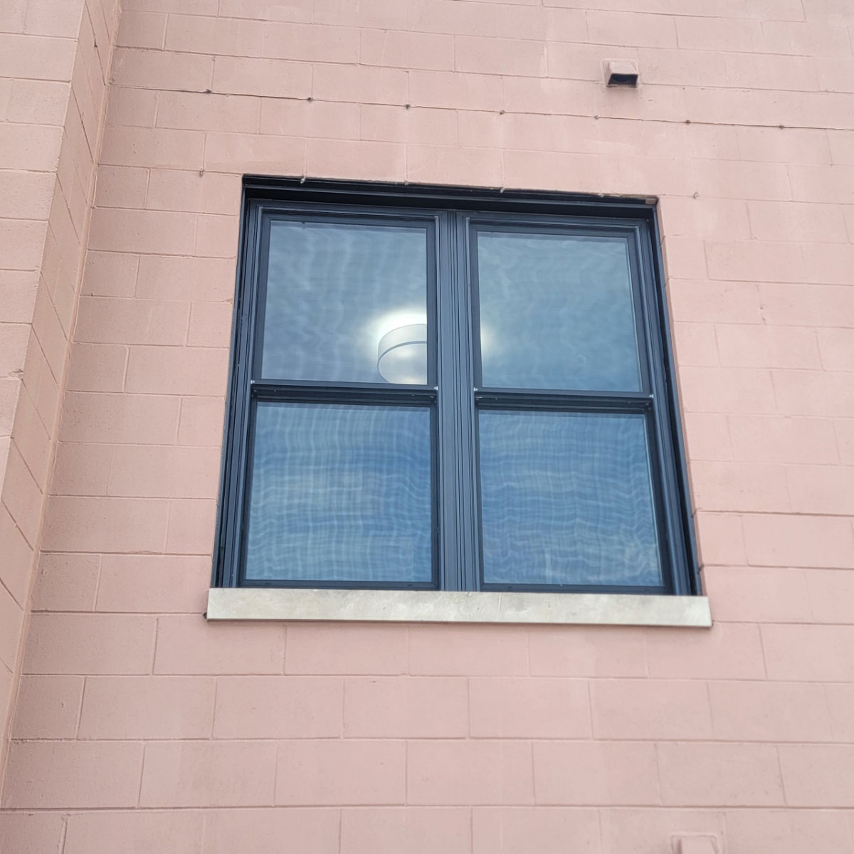 Pella Impervia fiberglass replacement window, brick exterior