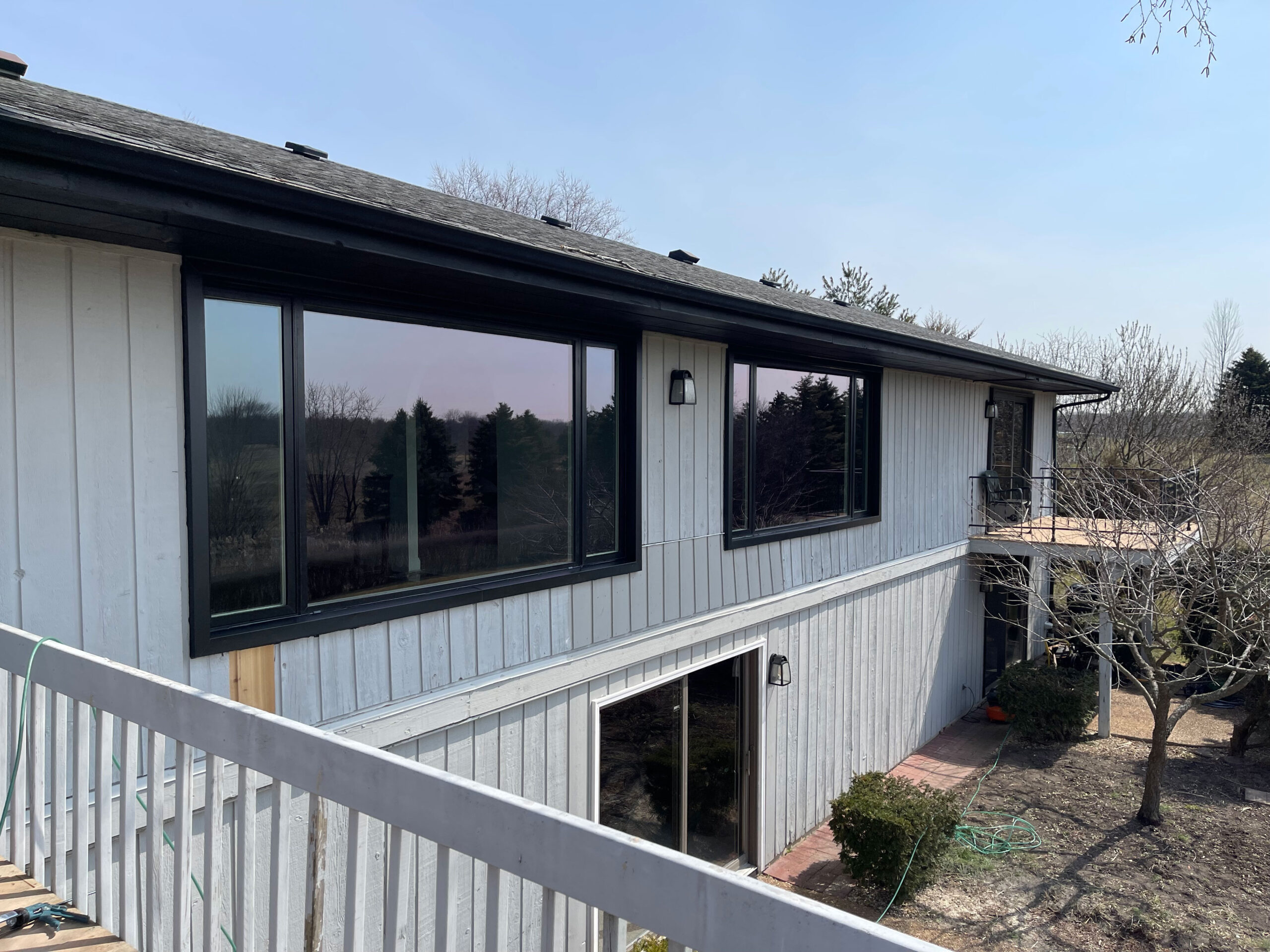 Pella Impervia picture window and slider, exterior