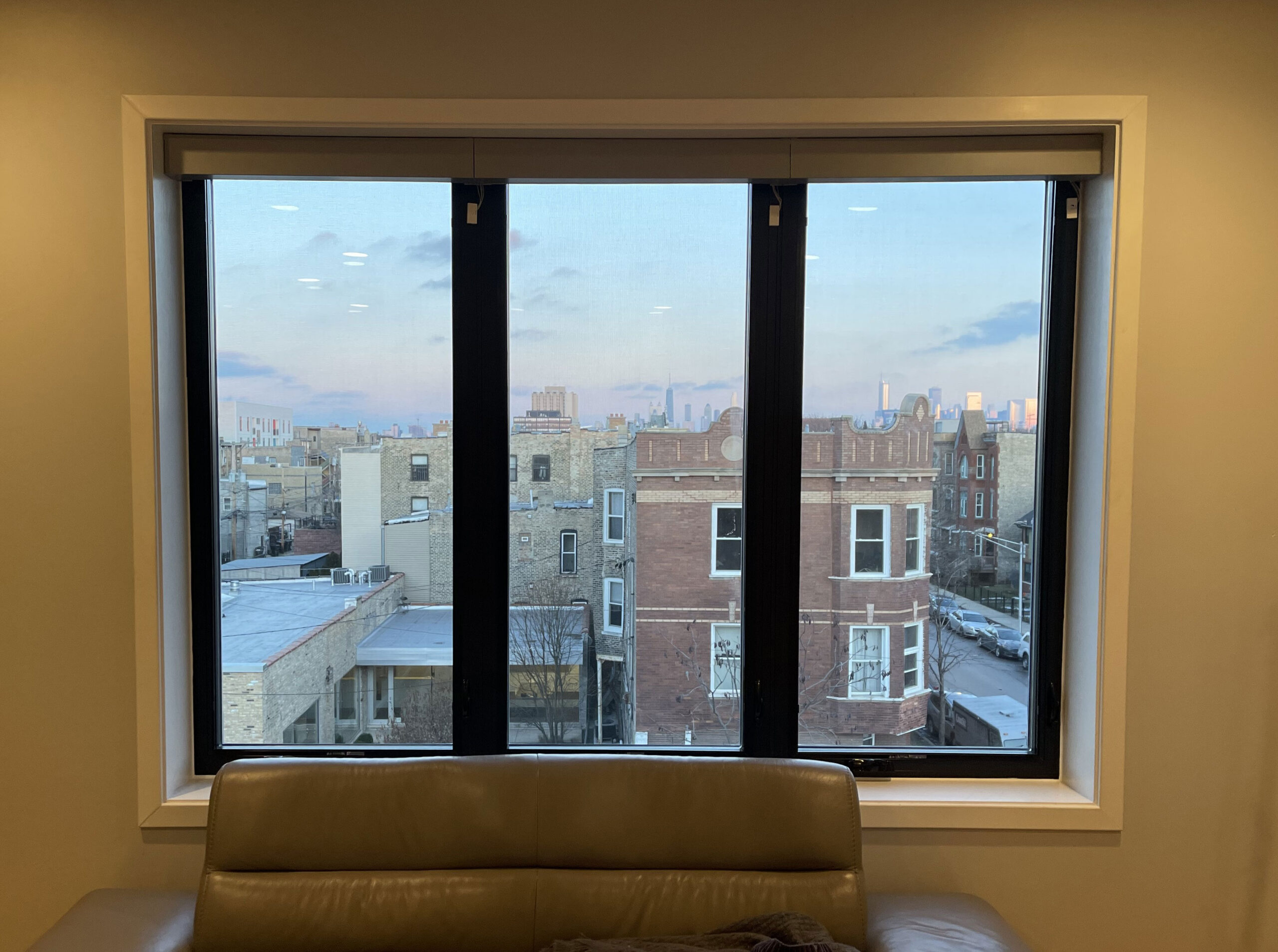 Pella Impervia fiberglass three-lite window, city view