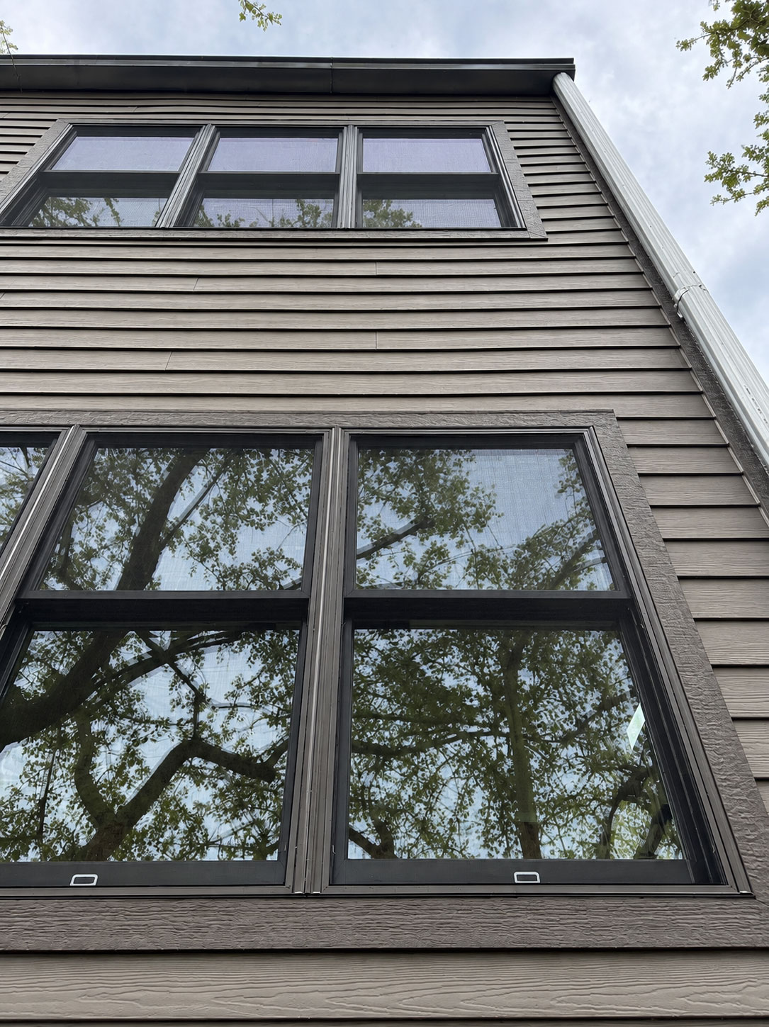 Pella Lifestyle Series wood double-hung window with shutters