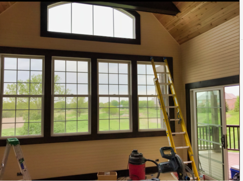 Sunroom Blue Siding Home
